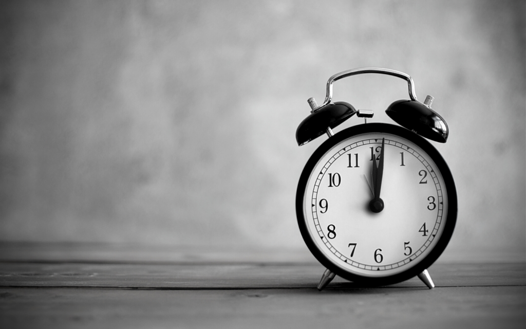 A clock sitting on top of a table. 