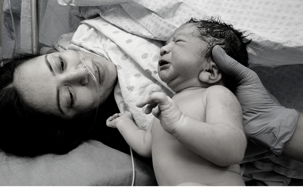 Mother meets her baby after C-section delivery.