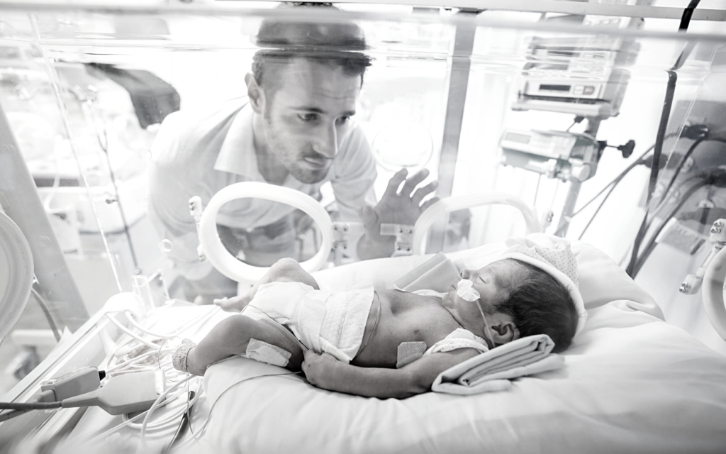 Father visits his baby in the NICU.