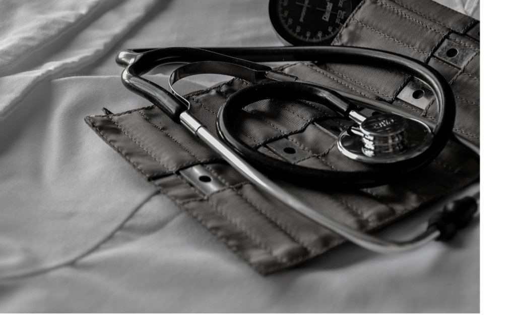 A black and white image of a doctor's stethoscope. 
