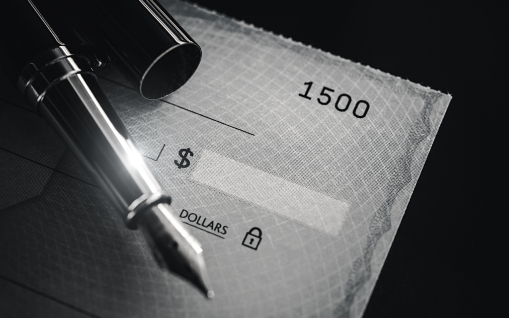Black and white image of a lawsuit settlement check.