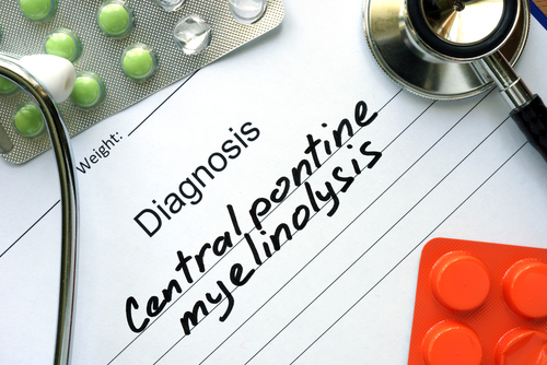 Paperwork with "Central Pontine Myelinolysis" written in bold, pills & stethoscope in corners.