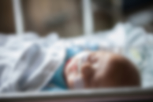 Blurred image of a baby in the hospital