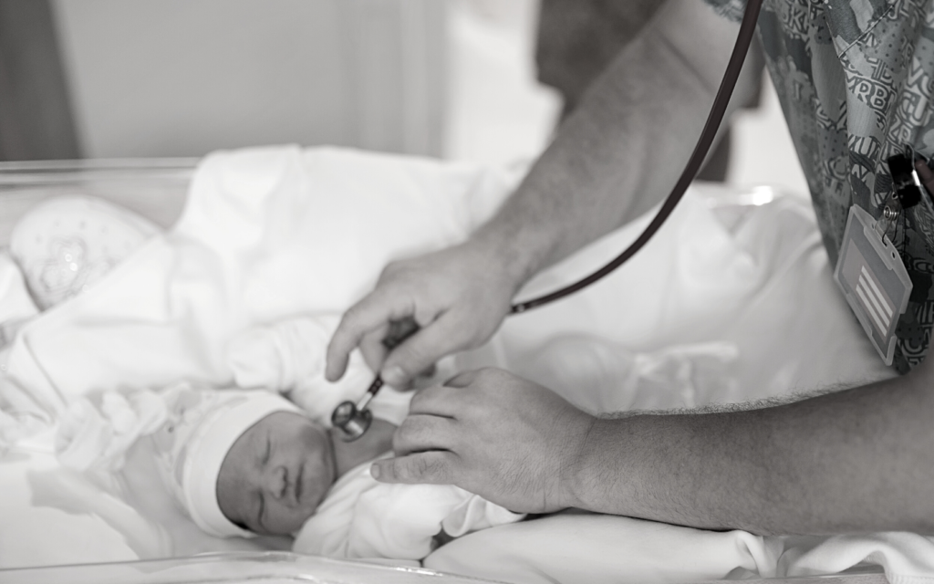 Doctor cares for baby with shoulder dystocia. 