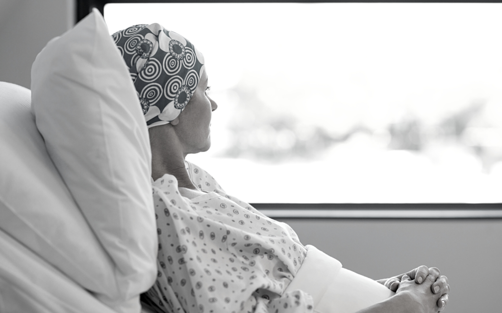 Woman in hospital because of cancer.