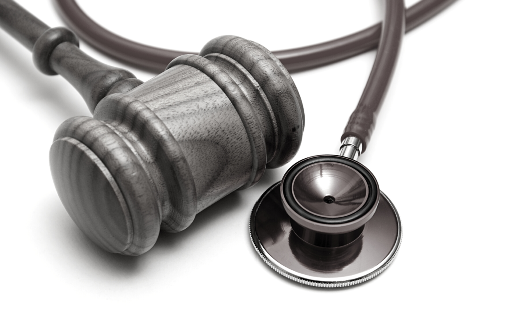 A gavel and doctor's stethoscope.
