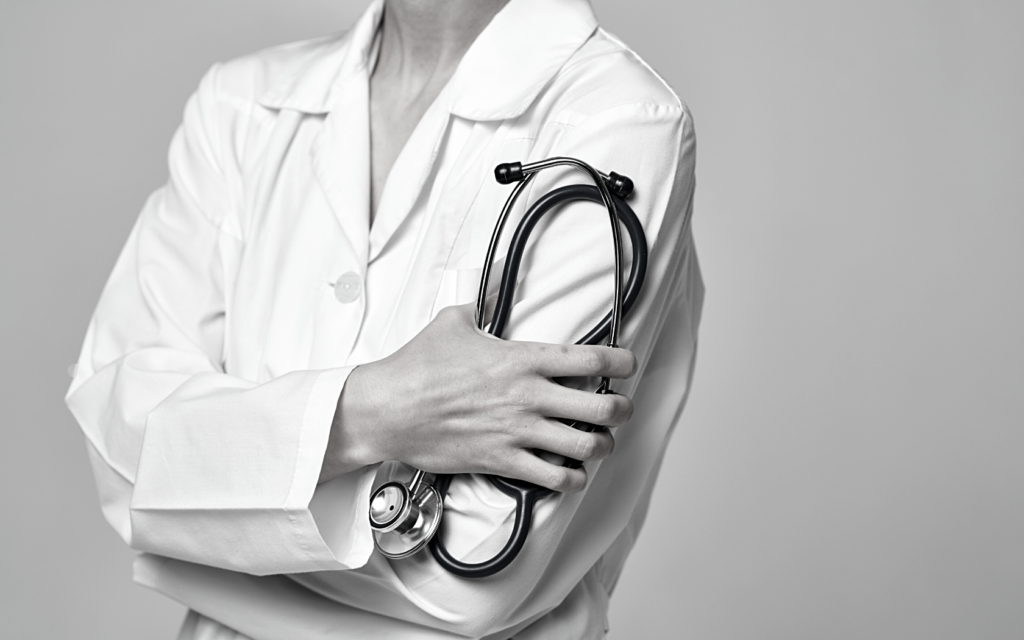 Doctor holds her stethoscope.