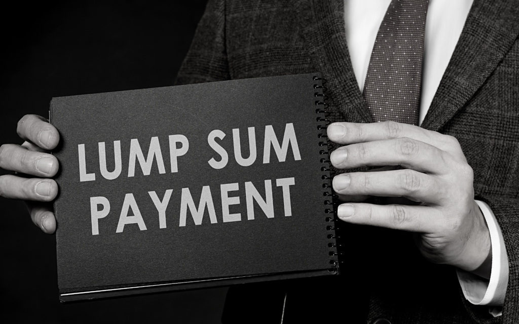 Man holds sign that says lump sum payment. 