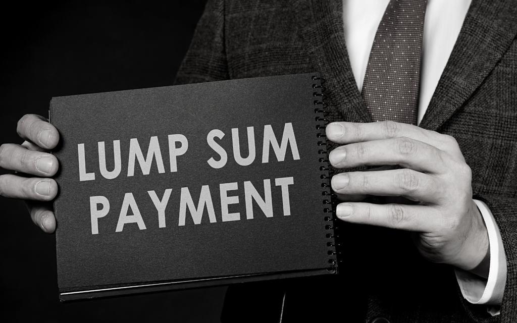 Man holds sign that says lump sum payment.