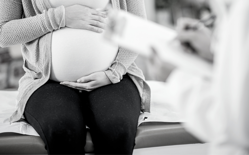 Pregnant woman at prenatal appointment.