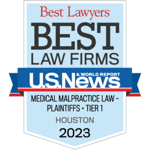 Blue US News badge with text: Best Law Firms Medical Malpractice Law Plaintiffs Tier 1 Houston 2023