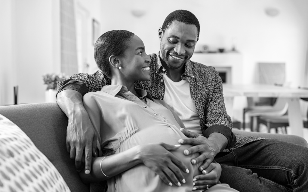 Black couple excited about arrival of baby.