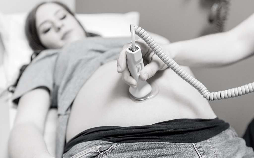 Pregnant woman has prenatal exam.