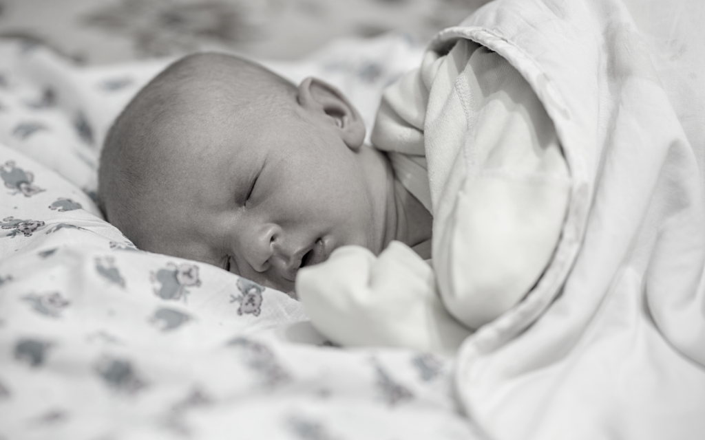 Baby being monitored for jaundice after birth.