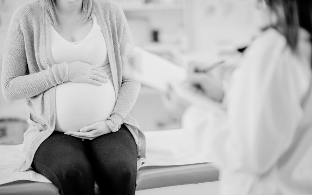 Pregnant mother receives prenatal care.