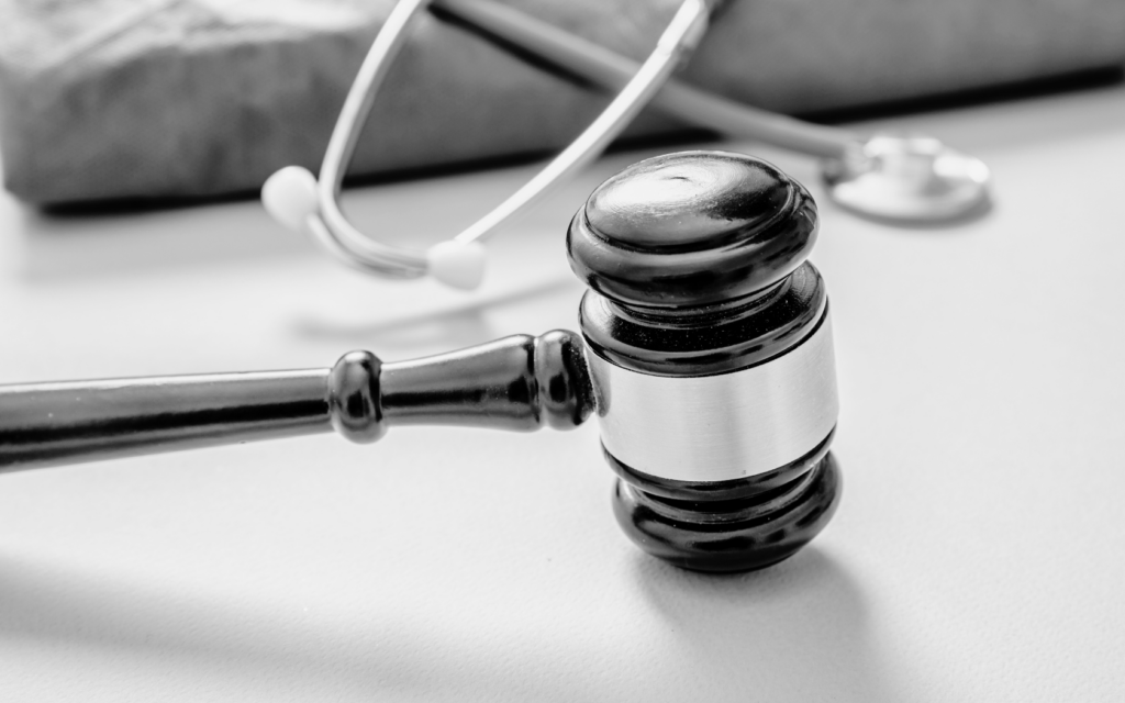 A gavel and stethoscope, representing the intersection of medical practice and legal justice.