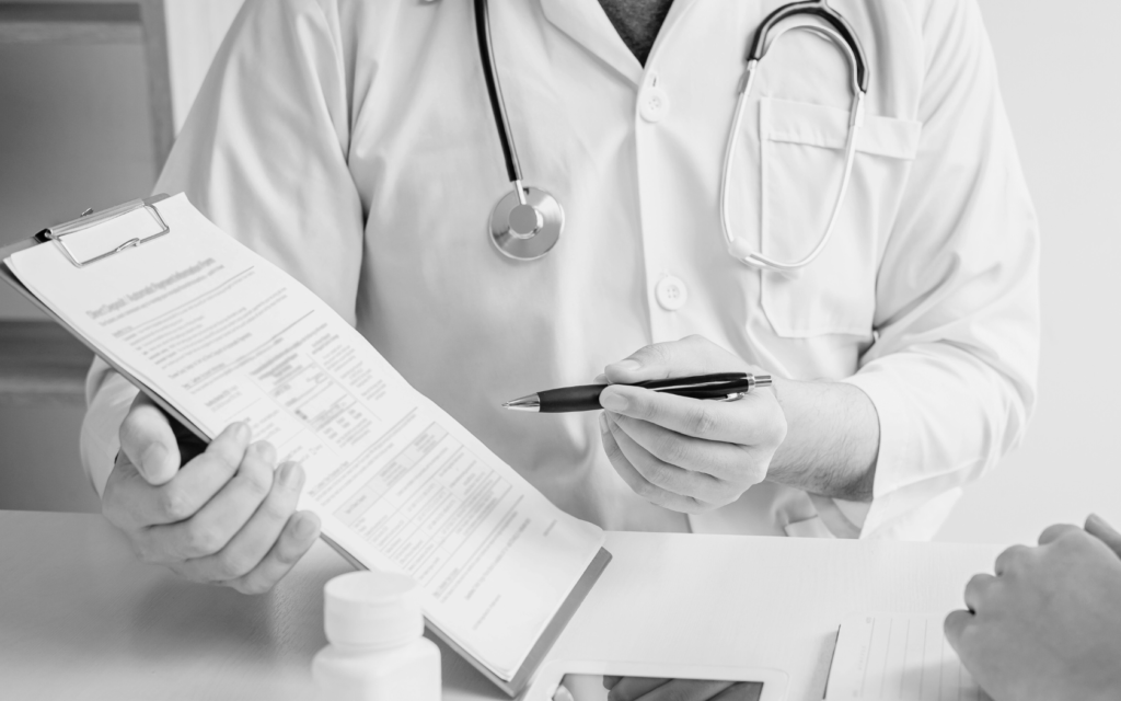 A doctor reviewing hospital treatment guidelines.