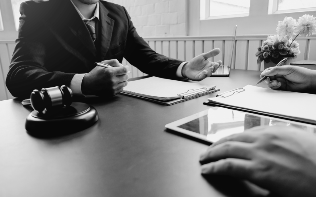 Hospital negligence lawyer in consultation with a potential client.