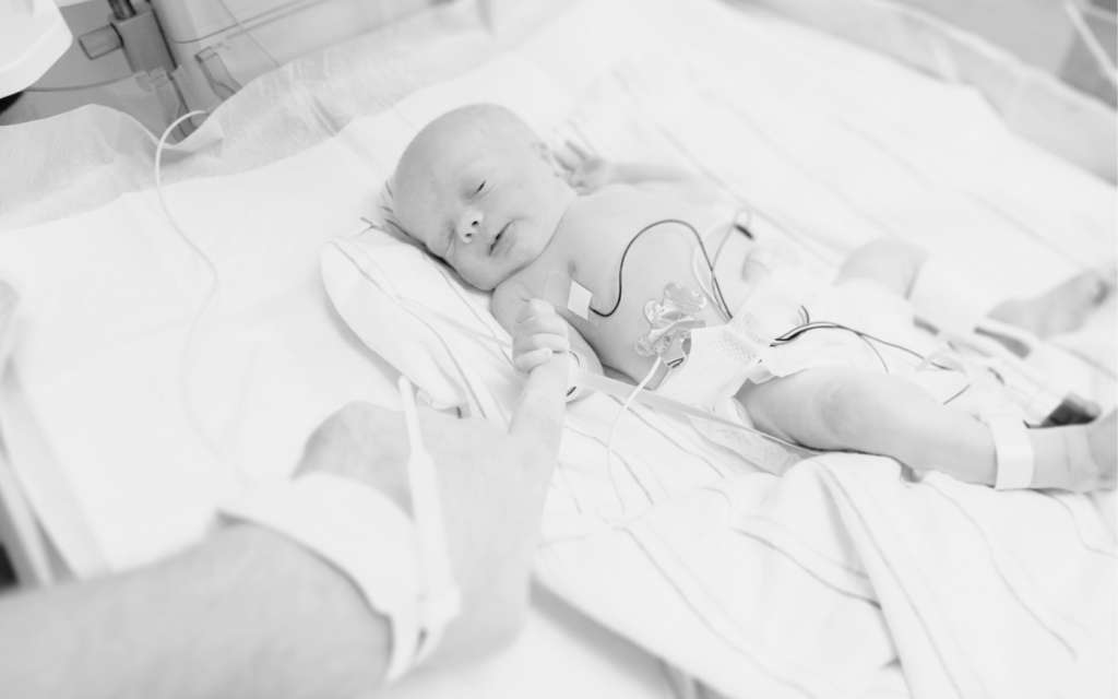 Newborn in NICU due to uterine rupture complications.


