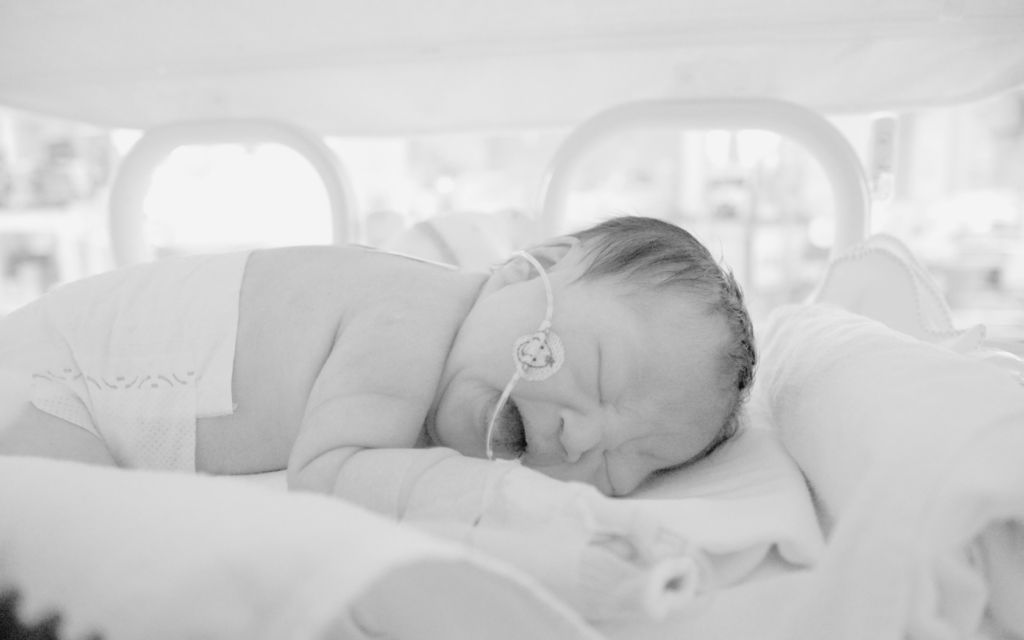Newborn baby girl receives care in NICU.