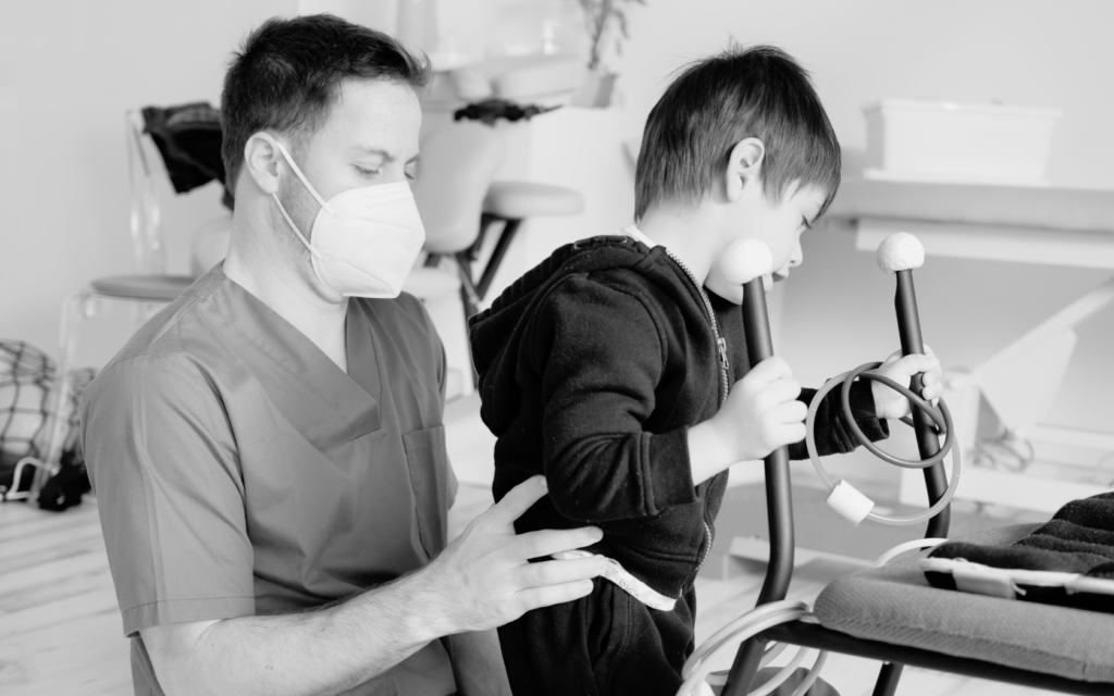 A child with cerebral palsy receiving physical therapy.