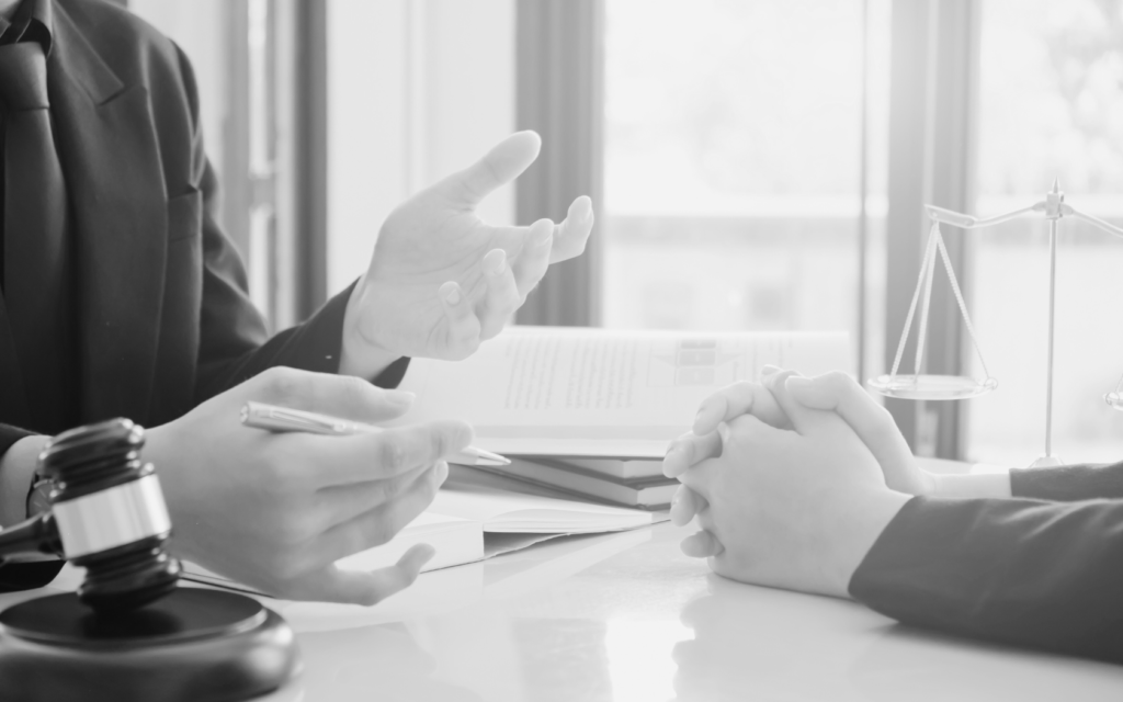 Lawyer discusses claim with client.