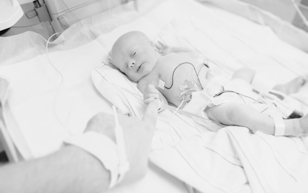 Newborn in NICU after a traumatic birth.