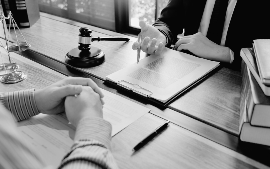 Mother talking with a lawyer about a negligence case after her child's stillbirth.